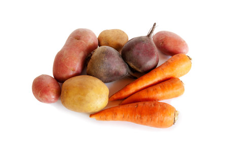 Fresh vegetables carrots, beetroots and potatoes isolated on white