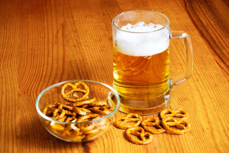 Bowl of pretzels and  mug of beerの写真素材
