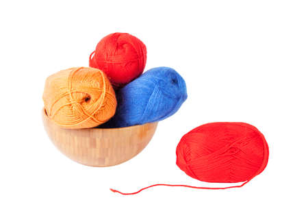 Knitting yarn in bowl, isolated on whiteの写真素材