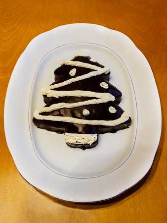 Homemade christmas cake in a shape of a christmas treeの写真素材