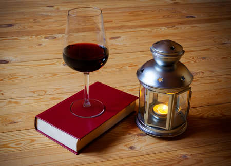 Wine, book and  lanternの写真素材