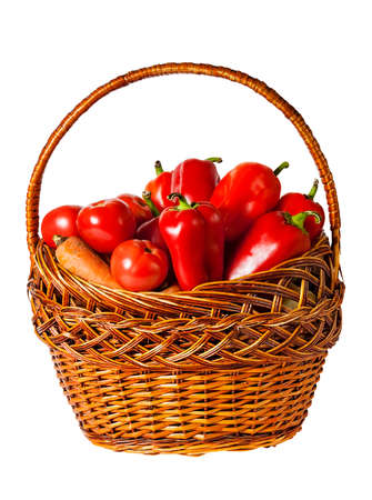 Vegetables in basket isolated on white backgroundの写真素材