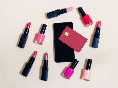 Online shopping cosmetics concept. Beige background. Top viewの写真素材
