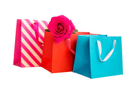 Colorful shopping bags and rose  isolated on white backgroundの写真素材