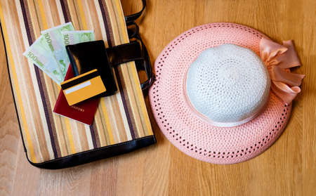 Travel accessories. Hat, wallet, bag, passport  prepared for the tripの写真素材