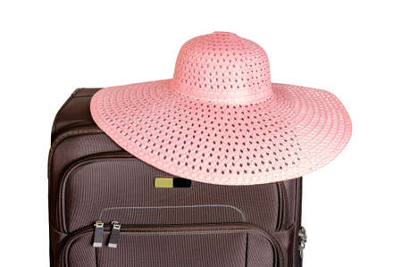 Brown suitcase and hat isolated on white backgroundの写真素材