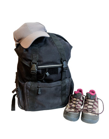 Backpack, cap  and shoes backpackers isolated on white backgroundの写真素材