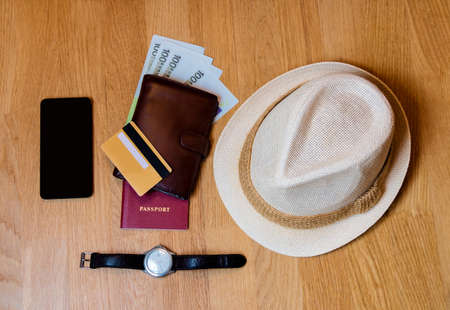 Travel accessories. Hat, wallet, passport  prepared for the tripの写真素材