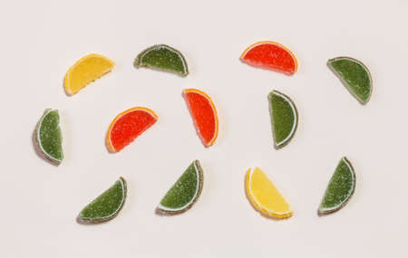 Colored marmalade sweets pattern on beige backgroundの写真素材