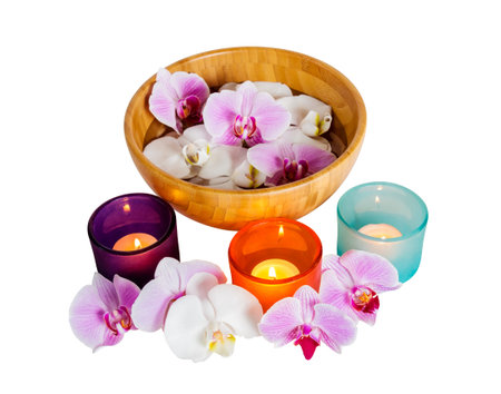 Orchids and candles isolated on white backgroundの写真素材