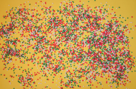 Colorful star sprinkles as a background. Sugar sprinkle stars, decoration for cake and bakery. Selective focus.の写真素材