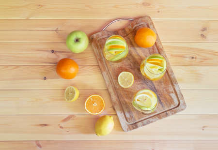 White wine sangria with fruits in glasses on cutting board and fresh fruits near. Top view, copy space.の写真素材