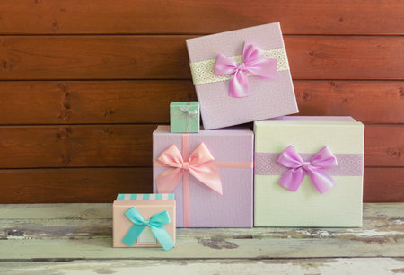 Gifts on wooden background. View with copy space.