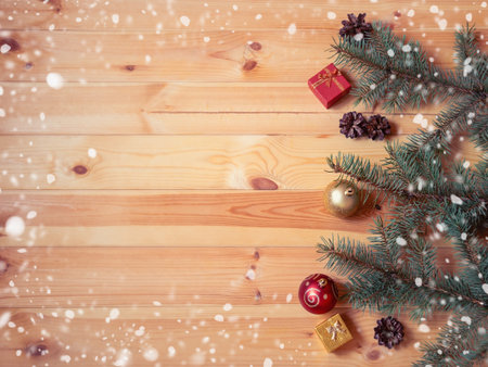 Christmas border of fir branches, balls and gifts. Top view, copy space.の写真素材