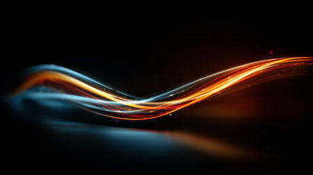 Dynamic light trails in orange and blue create a flowing abstract designの素材