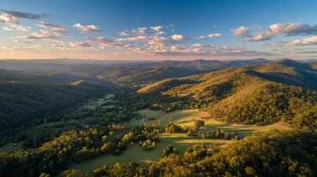 Rolling Hills and Lush Green Valleys Under a Blue Sky Panoramaの素材
