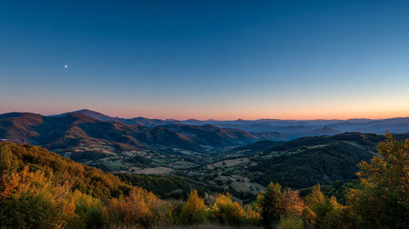 Serene Landscape at Dusk: Hills and Valleys under a Clear Twilight Skyの素材
