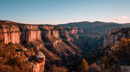 Majestic Canyon Landscape Illuminated by Golden Light at Dusk or Dawn.の素材