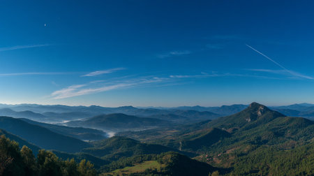 Breathtaking Vista of Mountain Ranges Under Clear Blue Sky With Streaks of Cloudsの素材