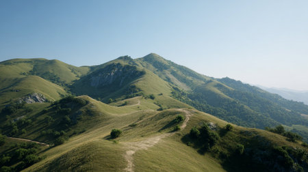 Rolling Hills Under a Clear Blue Sky, a Mountainous Green Vistaの素材