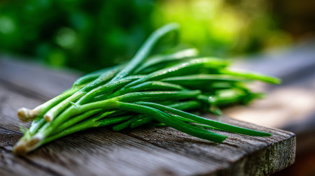 Freshly Harvested Green Onions Displayed on Rustic Wood Surface, Nature's Bountyの素材