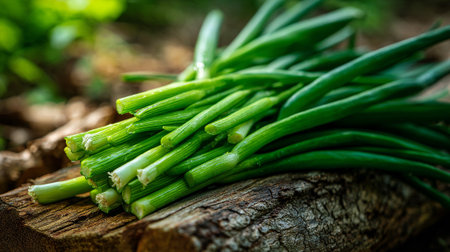 Freshly Harvested Green Onions Displayed on Weathered Wood Surfaceの素材