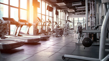 Modern gym interior with fitness equipment. Fitness and healthy lifestyle concept.の素材