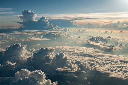 Clouds in the blue sky as seen through window of an aircraftの素材