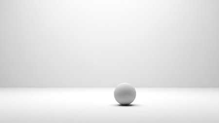 3d rendering of a white ball on a white studio background.の素材