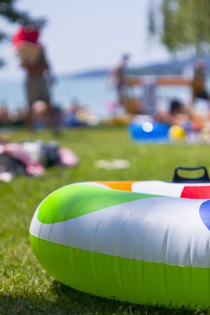 A green life belt for children in the beachの写真素材