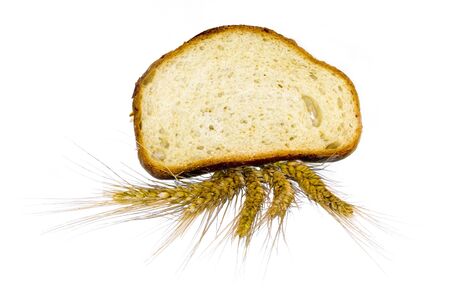 bread and grain ear on white backgroundの写真素材