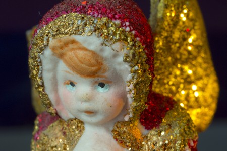 Red and gold christmas angel with golden starsの写真素材
