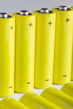 Lot of yellow battery in a row, with positive and negative sign