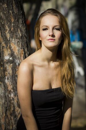 Young, beautiful woman in the city parkの写真素材