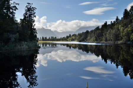 The lakeside landscapes and reflection at Lake Matheson, New Zealand.の写真素材
