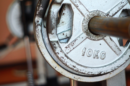 10 Kilograms weights for muscle building equipment to weightlifting or dumbbells at gym の写真素材