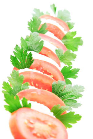 fresh vegetable salad with tomatos, cheese mozzarella and greensの写真素材