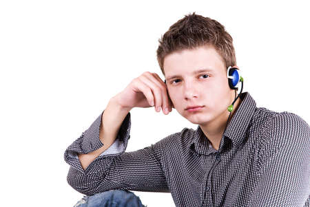 Portrait of a young man in headphone isolated on white backgroundの写真素材