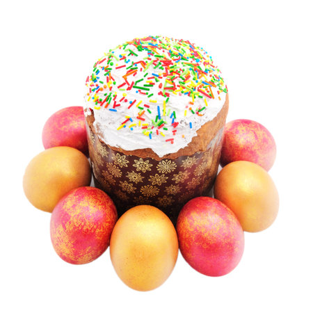 Easter cake with sugar glaze and painted eggs isolated on white background