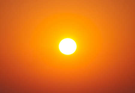 Bright sunset under the sea with yellow red gradient colorsの写真素材