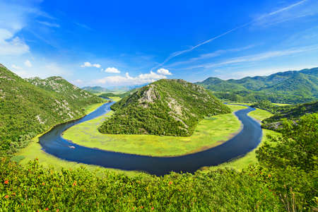 Canyon of Rijeka Crnojevica river in Skadar Lake National Park. One of the most famous views of Montenegro. The Green Pyramid and the bend of the river between mountains.の写真素材