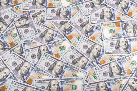 United states dollars currency background, many new one hundred USA money banknotesの写真素材