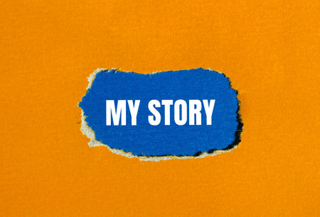 My story message written on torn orange paper with blue background. Conceptual my story symbol. Copy space.の写真素材
