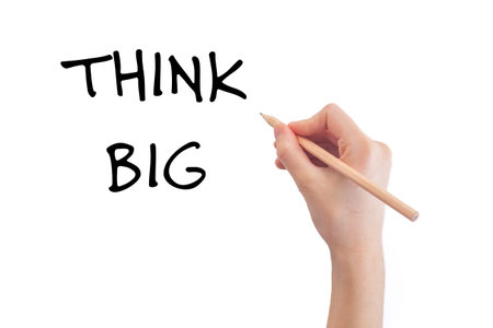 Hand writing think big message on white background. Conceptual think big message. Copy space.