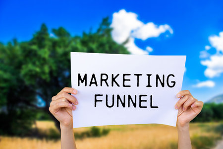 Marketing funnel message written on white paper with nature background. Conceptual marketing funnel symbol. Copy space.の写真素材