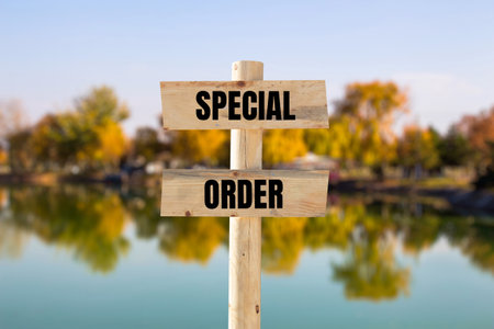 Special order message written on wooden sign with blurry nature background. Conceptual special order symbol. Copy space.の写真素材