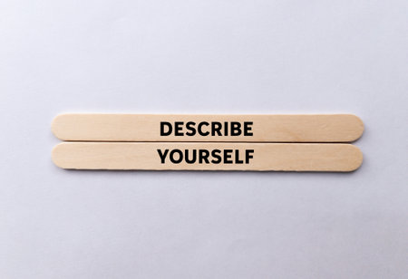 Describe yourself message written on wooden sticks on white background. Conceptual describe yourself symbol. Copy space.の写真素材