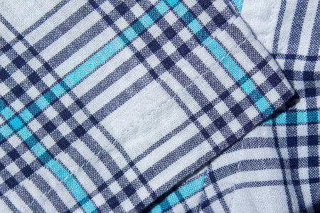 Classic blue and cyan plaid fabric texture as background