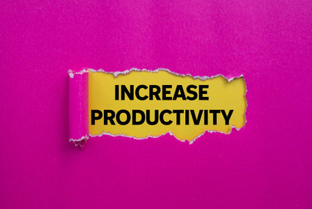 Increase productivity message written on ripped torn pink paper on yellow background. Conceptual increase productivity symbol. Copy space.の写真素材