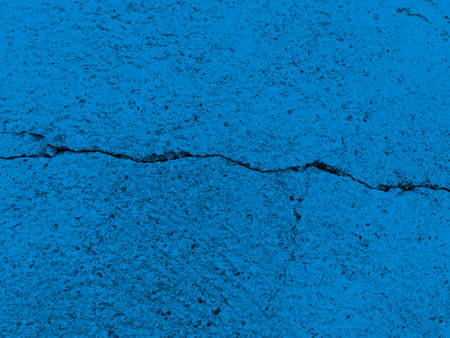 Abstract cracked blue grunge concrete wall distressed texture as backgroundの写真素材